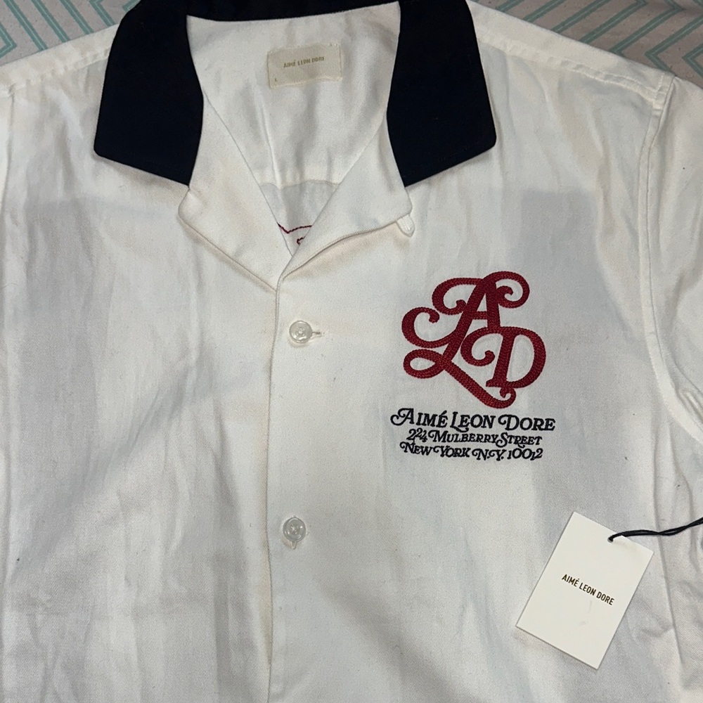 Aime Leon Dore Button Down White Shirt with Black Collar and Red Logo